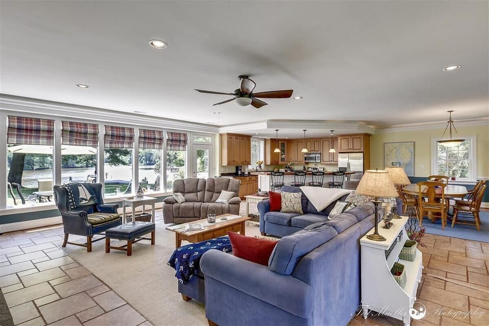 large, open main room with full wall of windows overlooking Fishing Creek