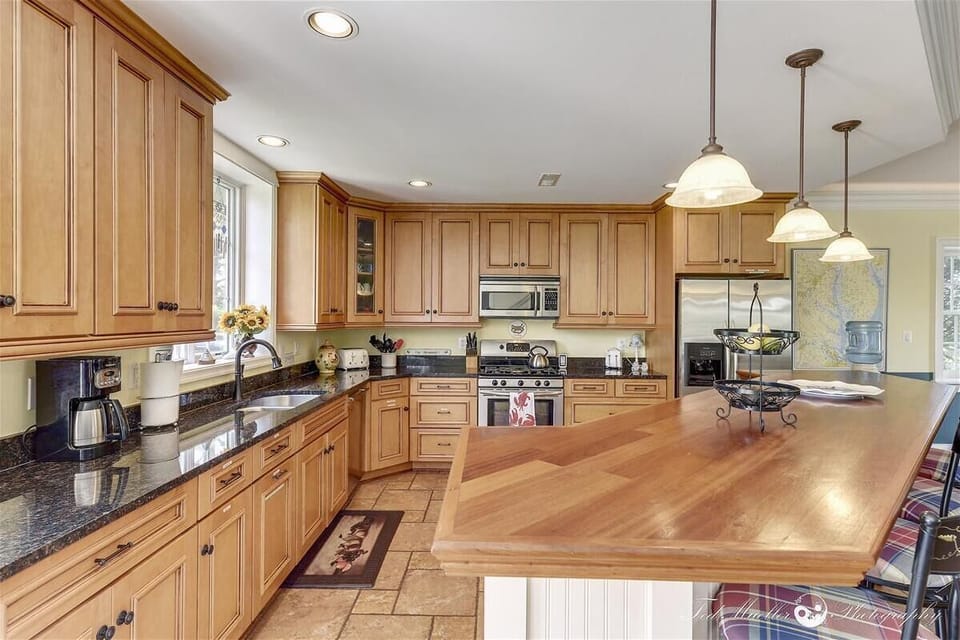 Modern, fully equiped kitchen with beautiful wooden island