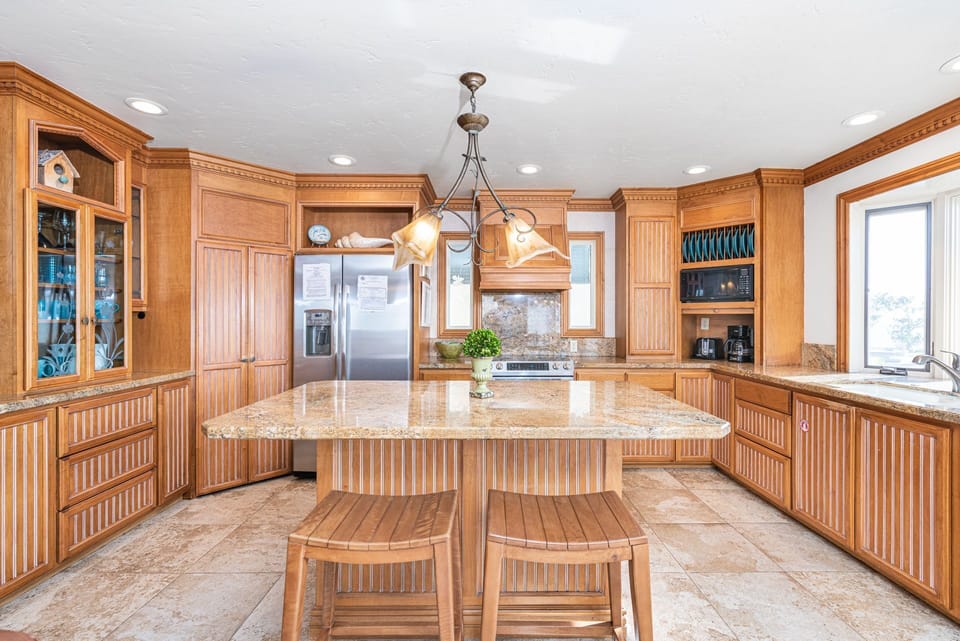 The kitchen comes stocked with dishes, utensils, cookware, bakeware, and large and small appliances.
                