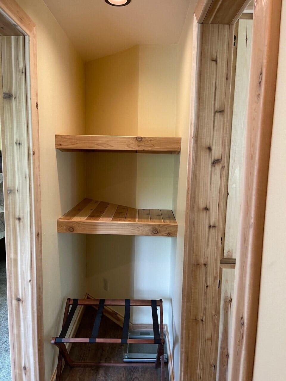 Cedar Primary Bedroom Closet w/ luggage rack & scale for your suitcase, not you.