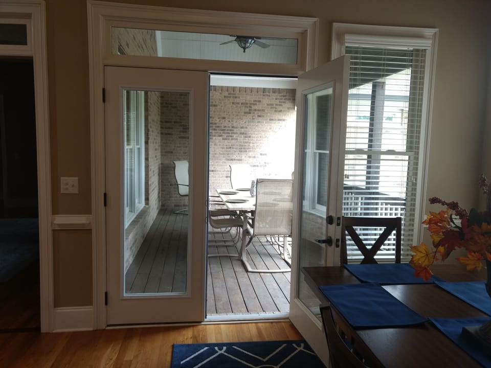 French Doors lead to patio / deck -- from the main floor kitchen