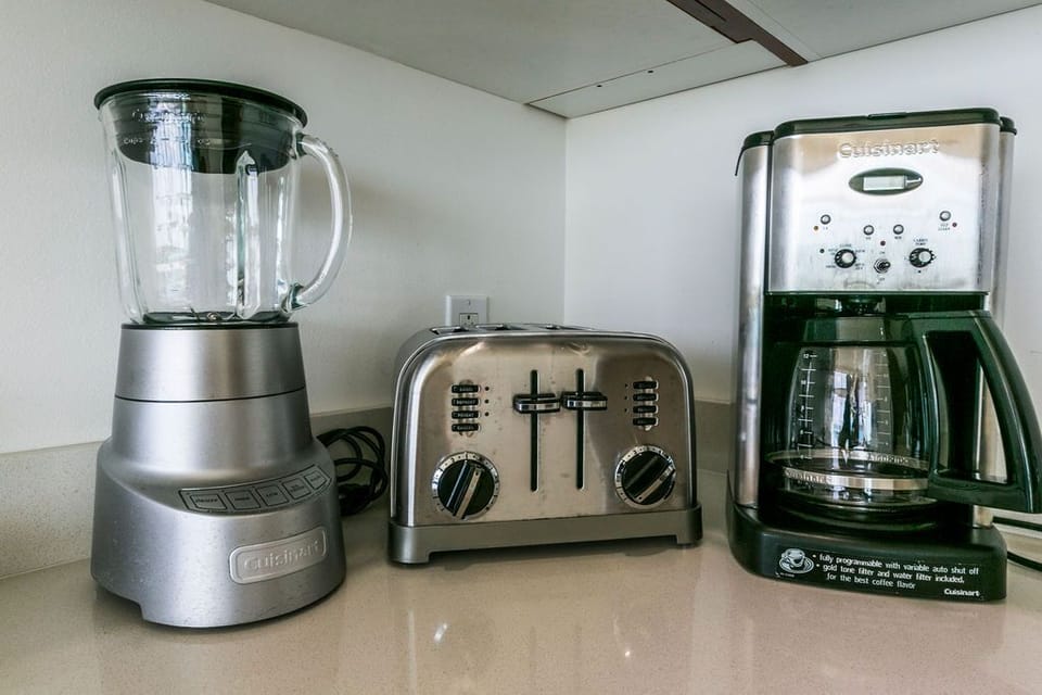 You'll find everything you need to whip up your morning coffee or breakfast with this Cuisinart coffee maker, toaster, and blender ready to use.
