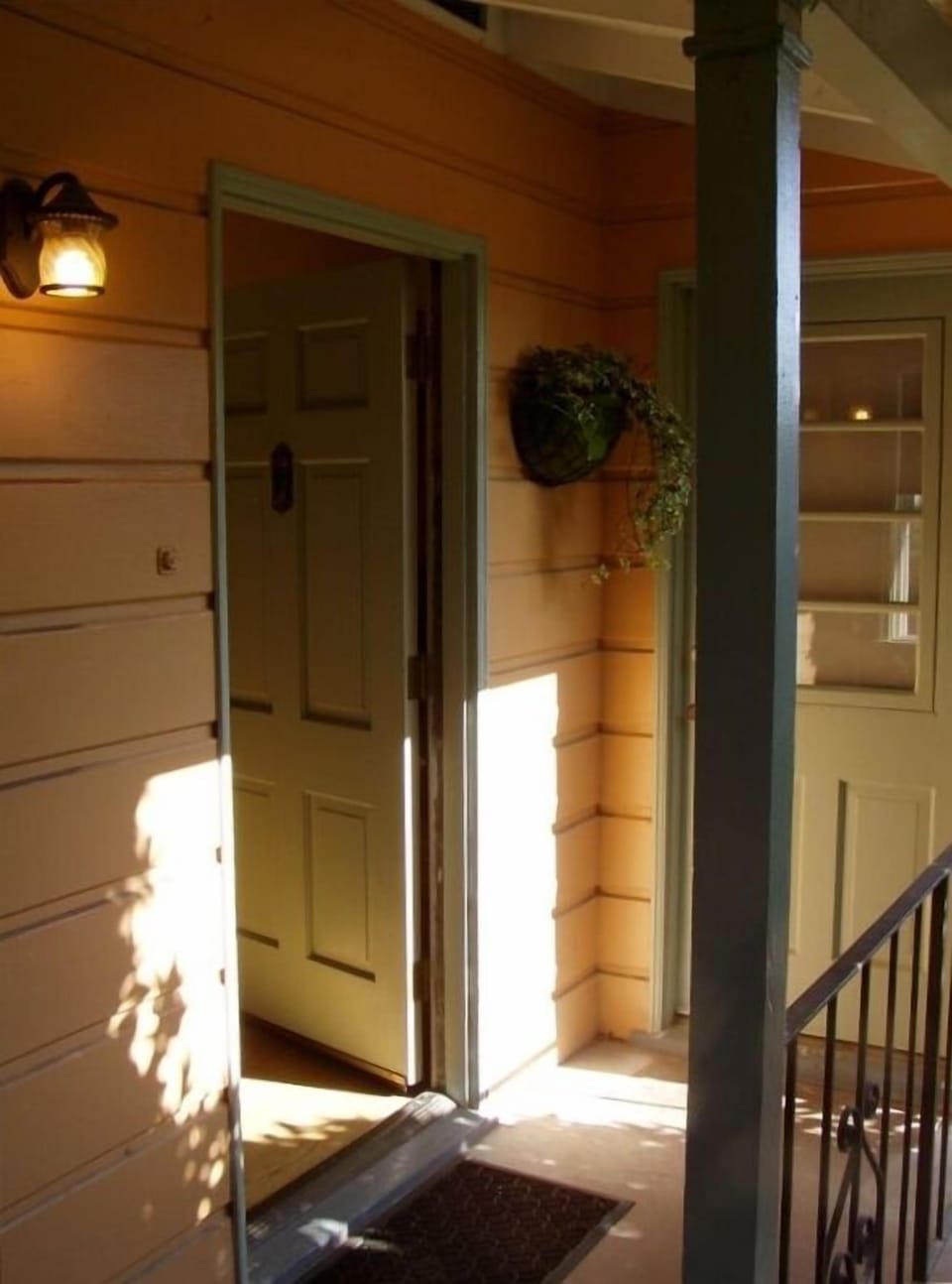 Two entrance doors to living room and kitchen