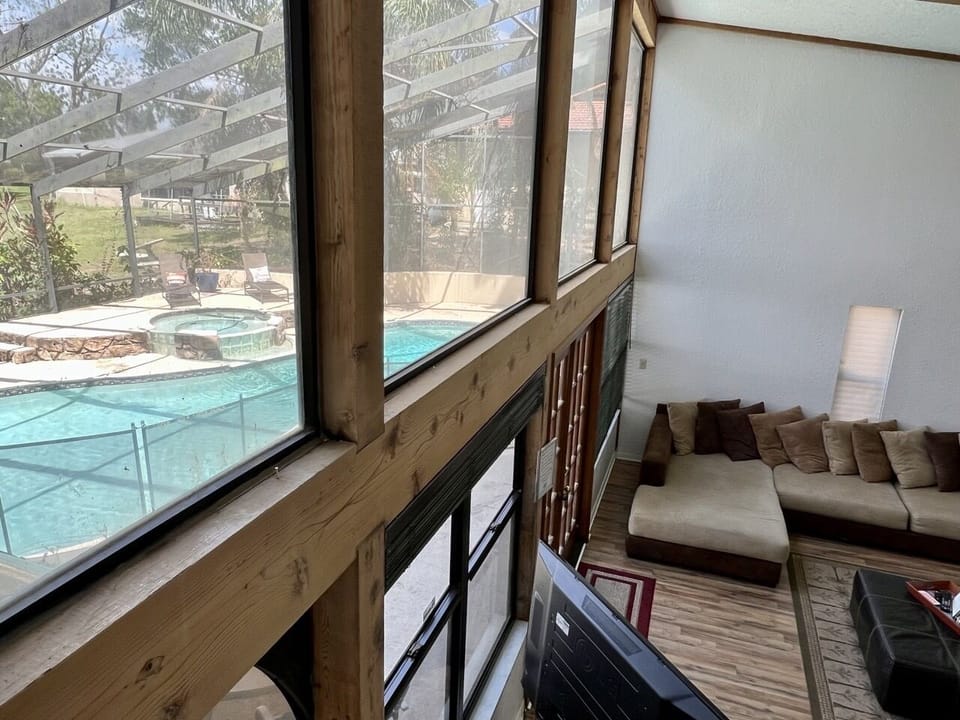 View from stairway of pool/great room