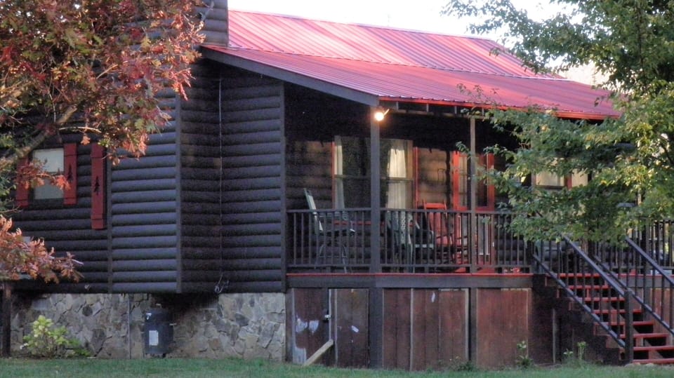 Back view of cabin at sunset
