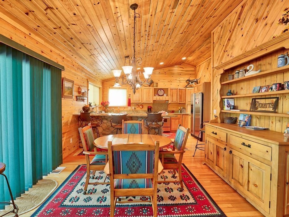 Dining Area includes table for 4 and 5 bar stools