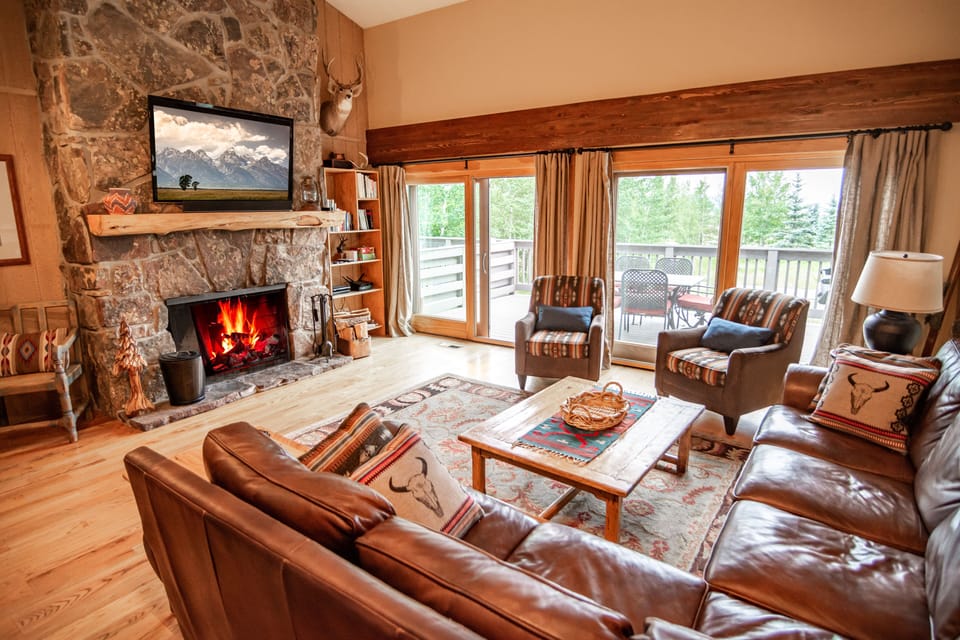 Family room with large patio doors opening to the deck.