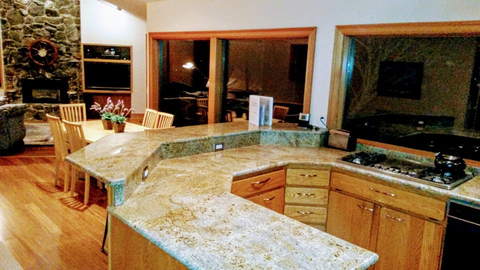 view from Kitchen to the living room fireplace and entertainment center