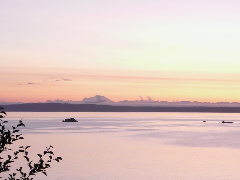 Mt Baker and Cascade Range at sunset. from deck and solarium.. 
