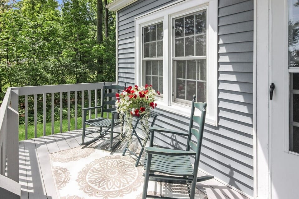 Sit on the porch and enjoy West Bay views or enjoy the backyard with forest.