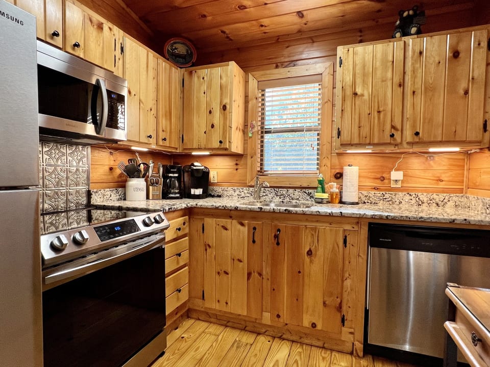 Under cabinet lighting and new granite counters make it easy to prep meals