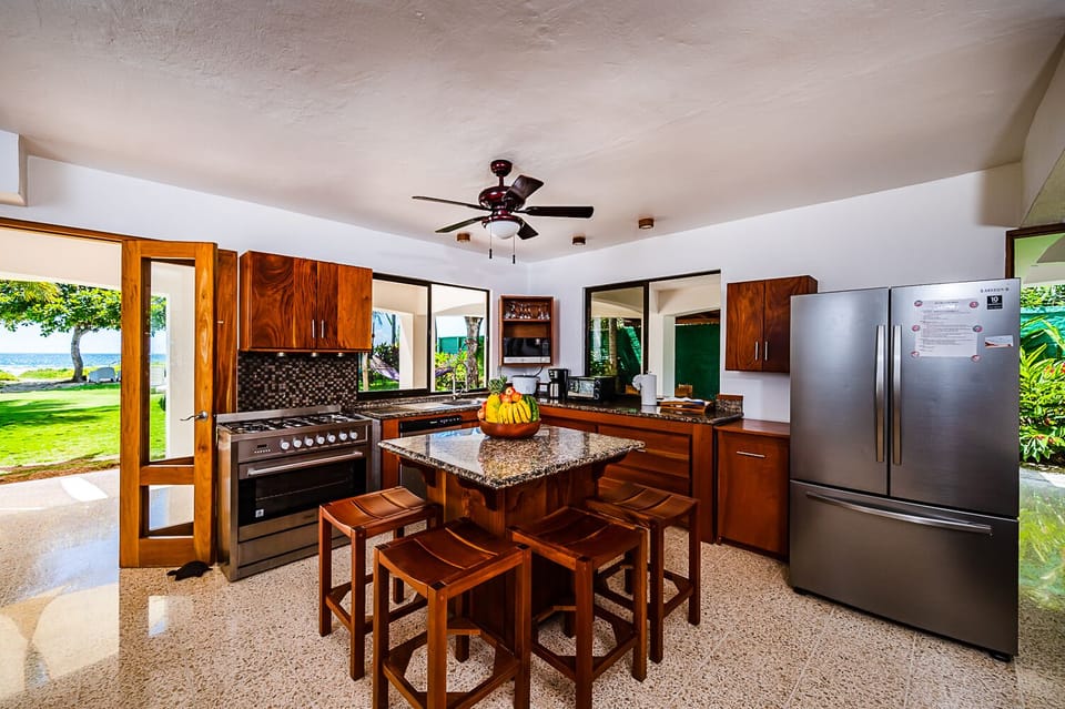 Full Kitchen, granite counter top and island. 