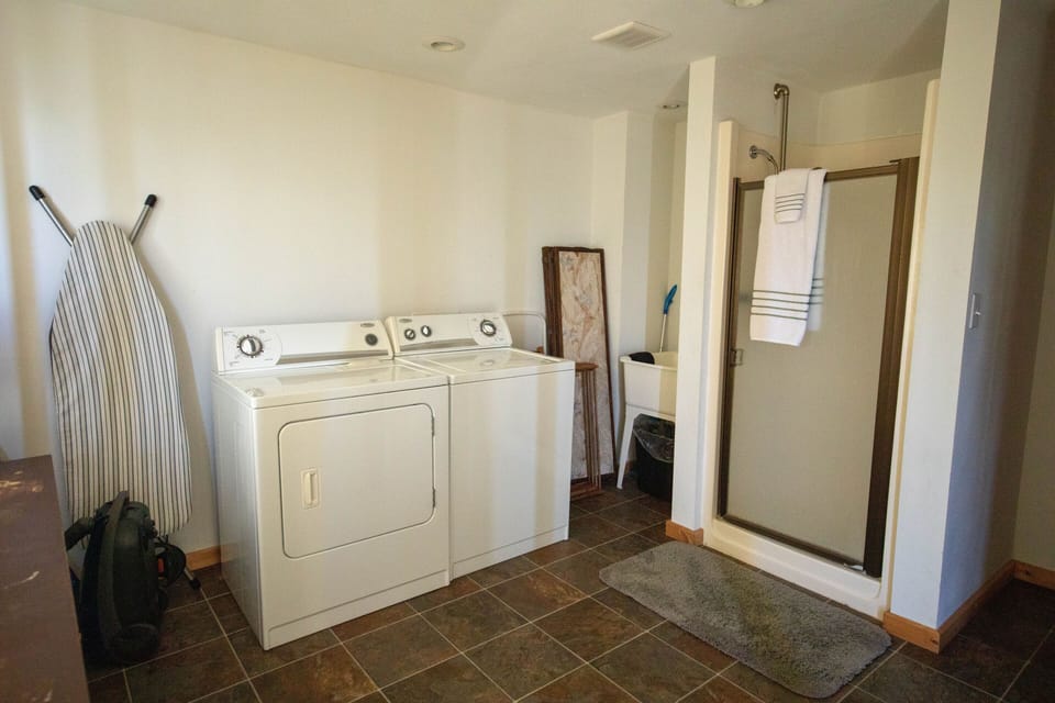 Laundry room with extra shower, first floor