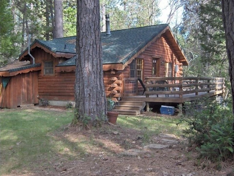 Relax on the large deck under the trees.