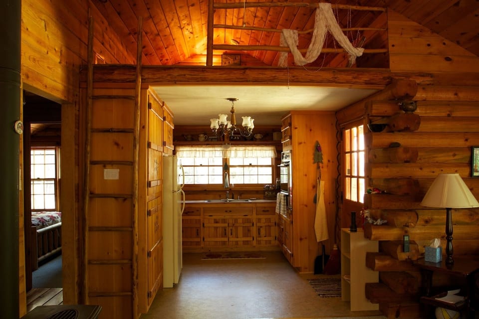 Kitchen with small loft above.