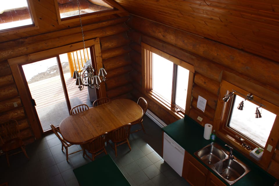View looking over the dining room and kitchen area.