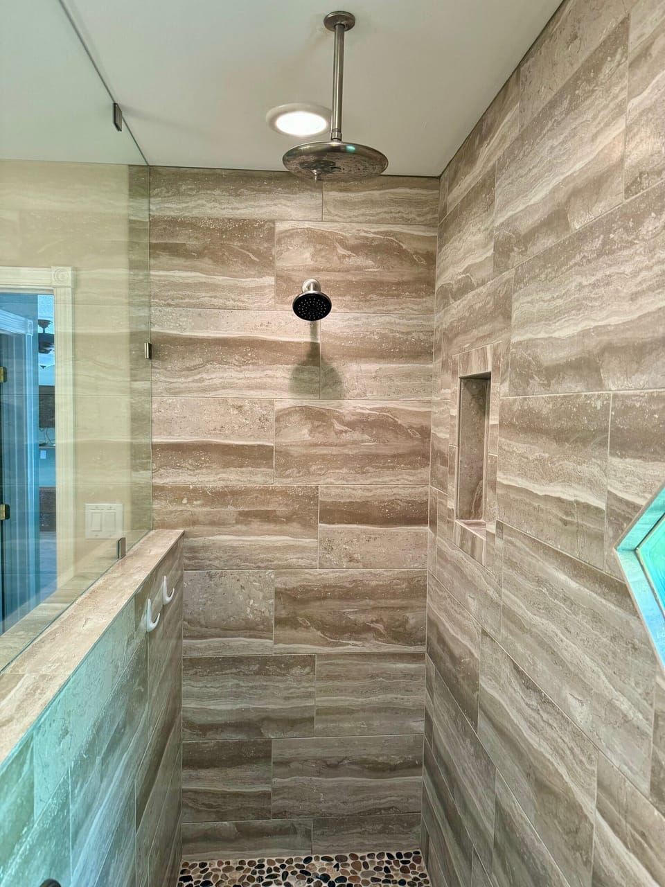 Primary Bath with Walk in Shower w/Rain Head and Pebble Tile Flooring