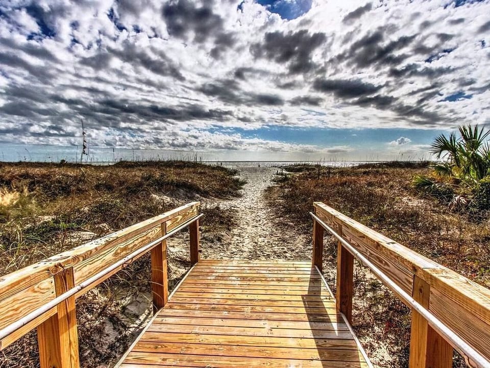 Boardwalk over sand dune to beach