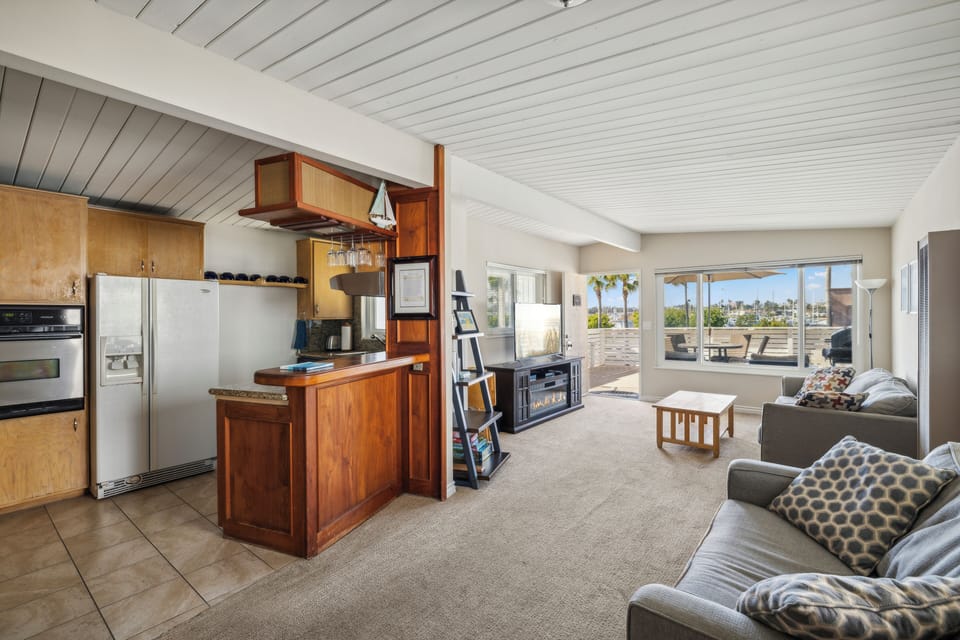 Kitchen and living room with sofa/beds, cable TV, and free wifi