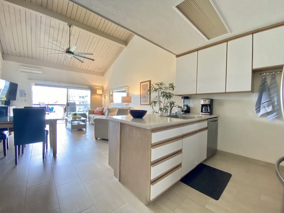 Bright open feeling living space with a high ceiling. Plus 55" Samsung Smart TV.