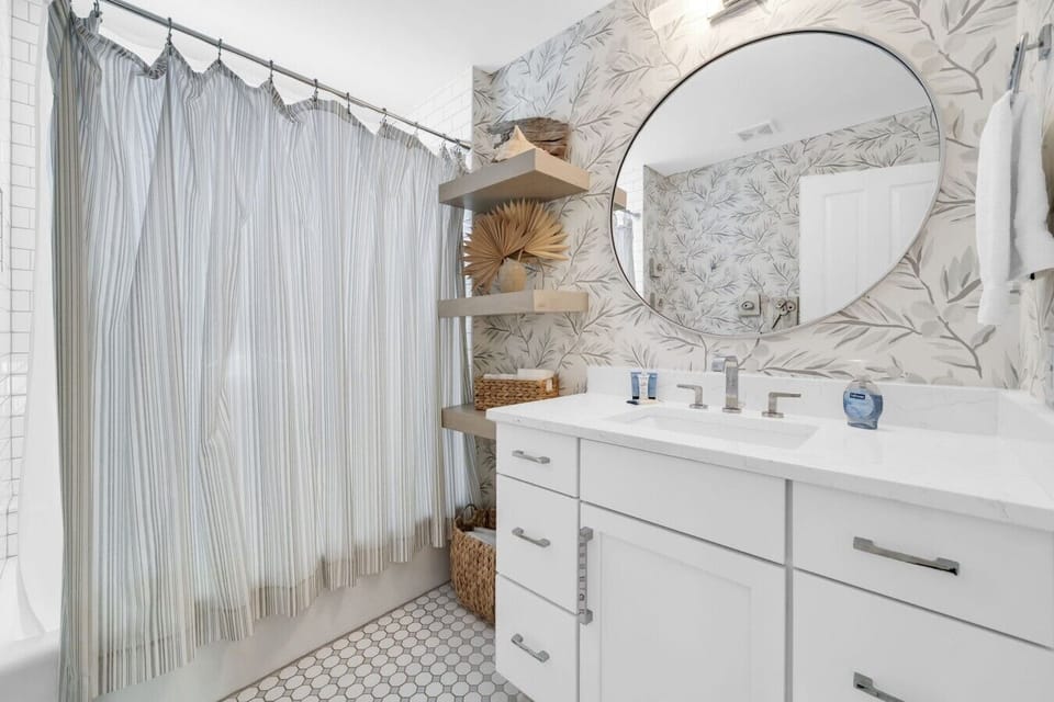 Upstairs bath with full tub/shower combination.
