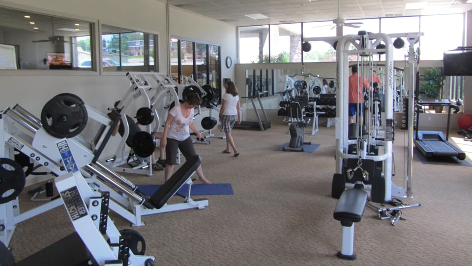 Fully equipped exercise room at the clubhouse. Pool table and large open area