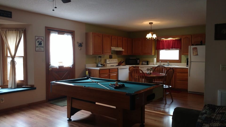 Clean and spacious with lots of natural light. Gas fireplace. Pool table.
