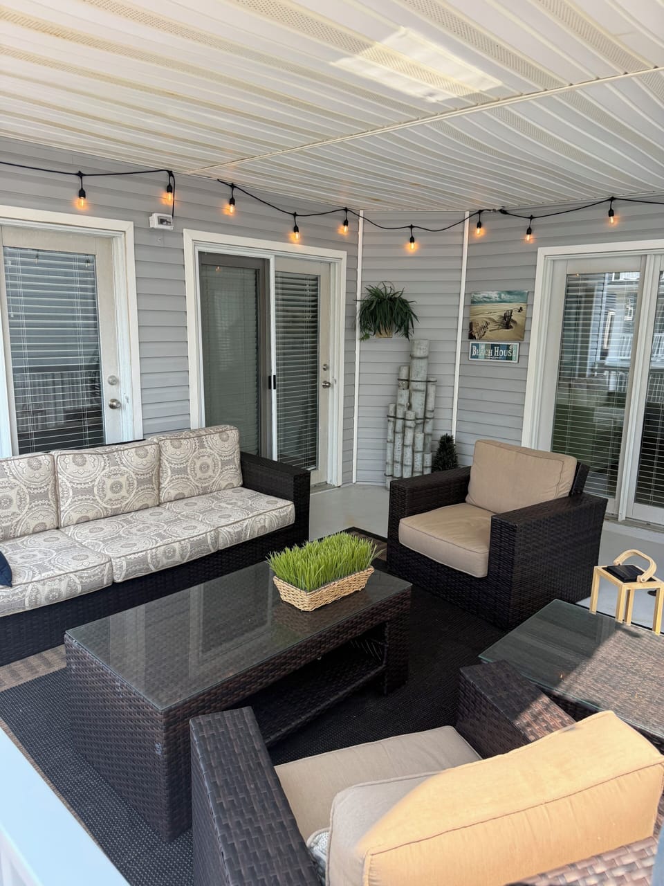 2nd covered porch.  Back deck with partial ocean view 