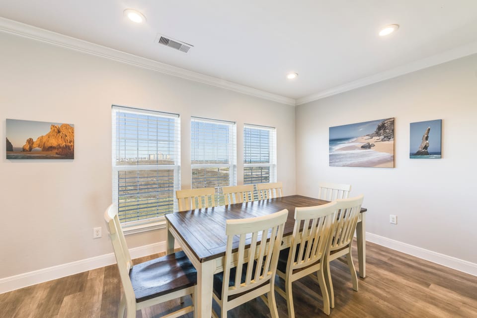 Gather around this spacious dining table where your group can share memorable meals together in comfort and style.