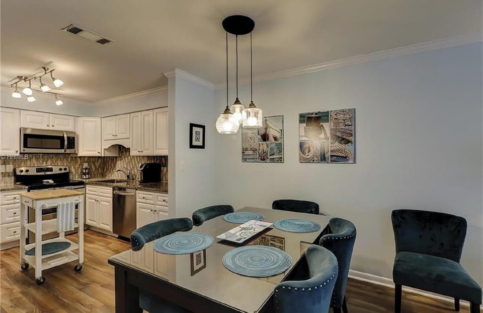 fully stocked kitchen with dining room seating for 6 people