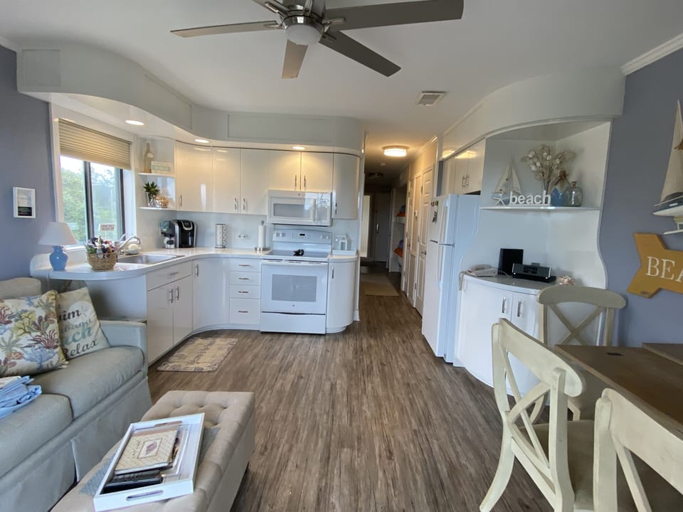 Well stocked kitchen with small safe to lock valuables while at the beach/oool