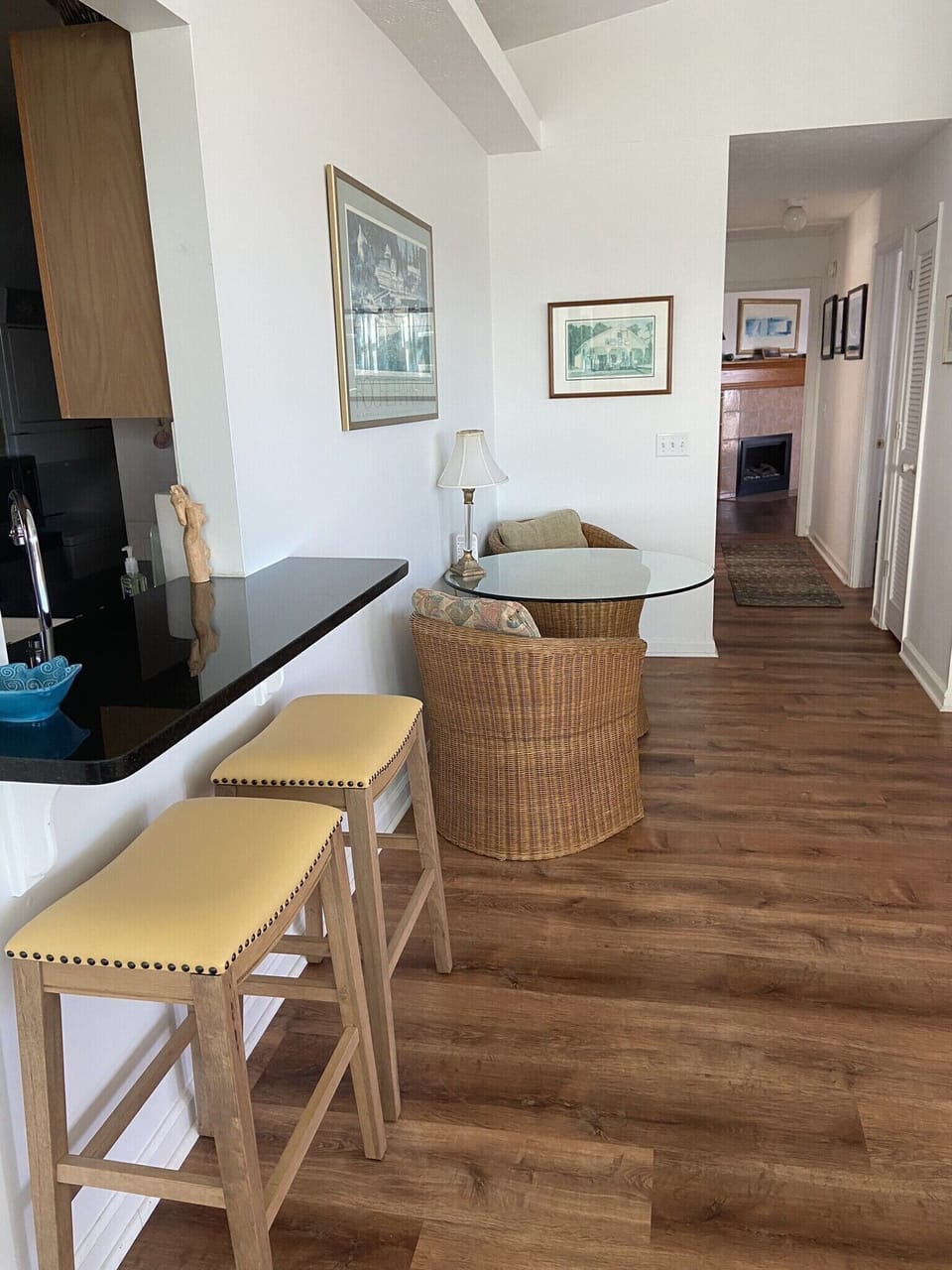 Bar space, extra dining or computer space, and hallway to bedrooms and baths.
