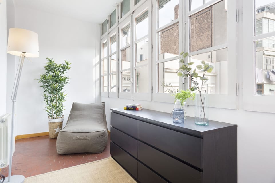 Enclosed balcony with seating