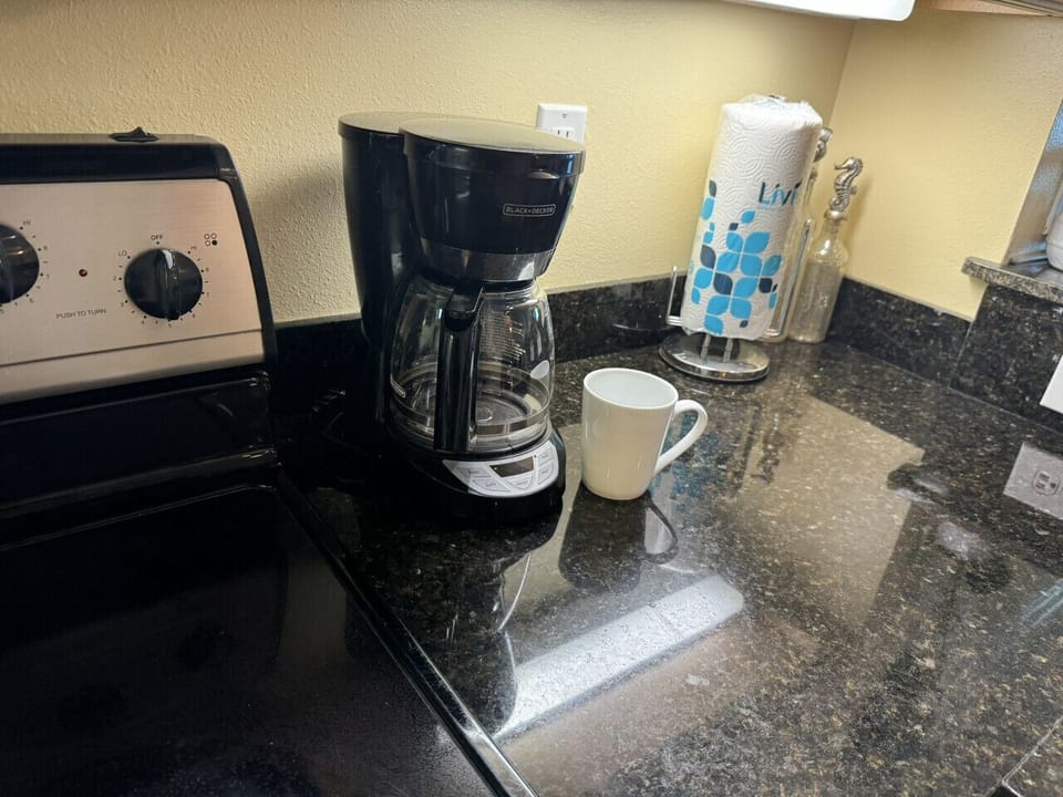 Standard drip machine in unit with plenty of mugs