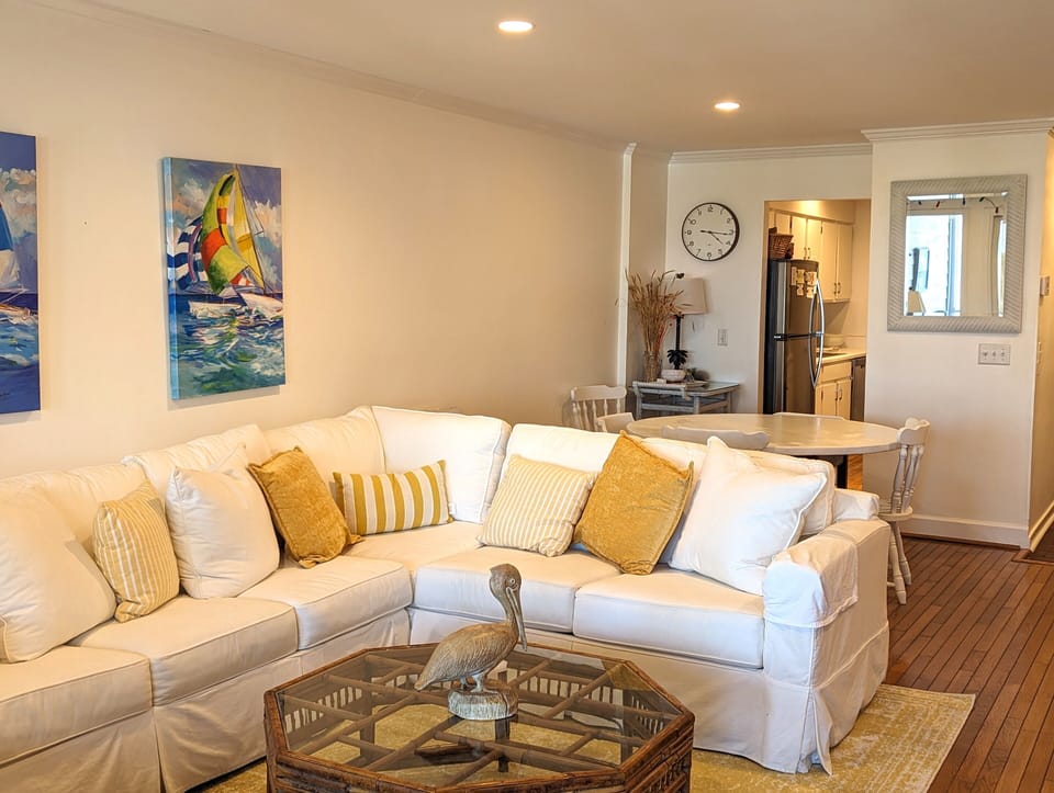 Den. New sofas 2024. The sofa also has a navy slip cover.