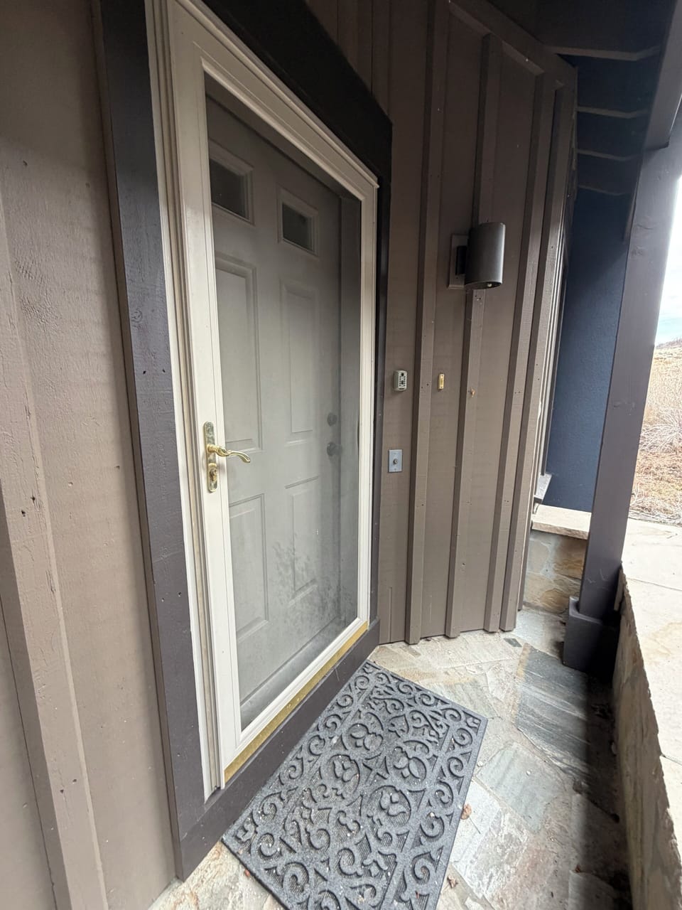 Front door, off the street and covered.