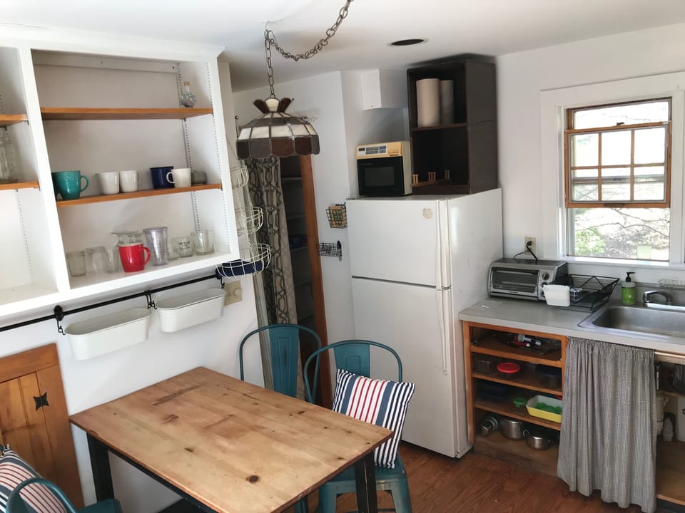 Kitchen island, looking toward fridge and pantry