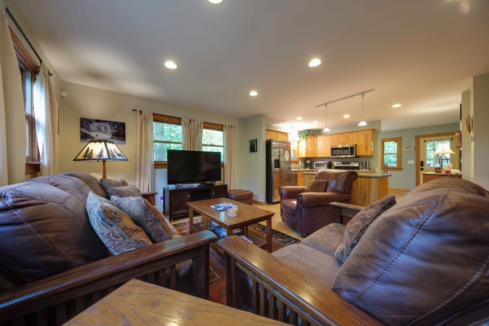 Living room has a large smart TV with streaming "cable" channels.