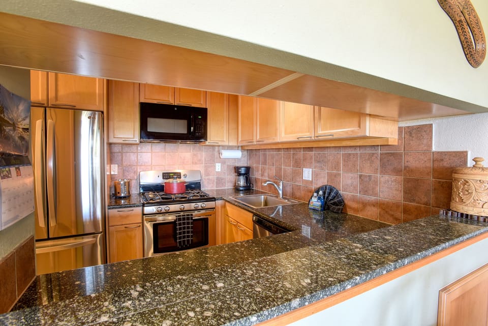 Functional kitchen has ample counterspace and cabinets, perfect for a long stay