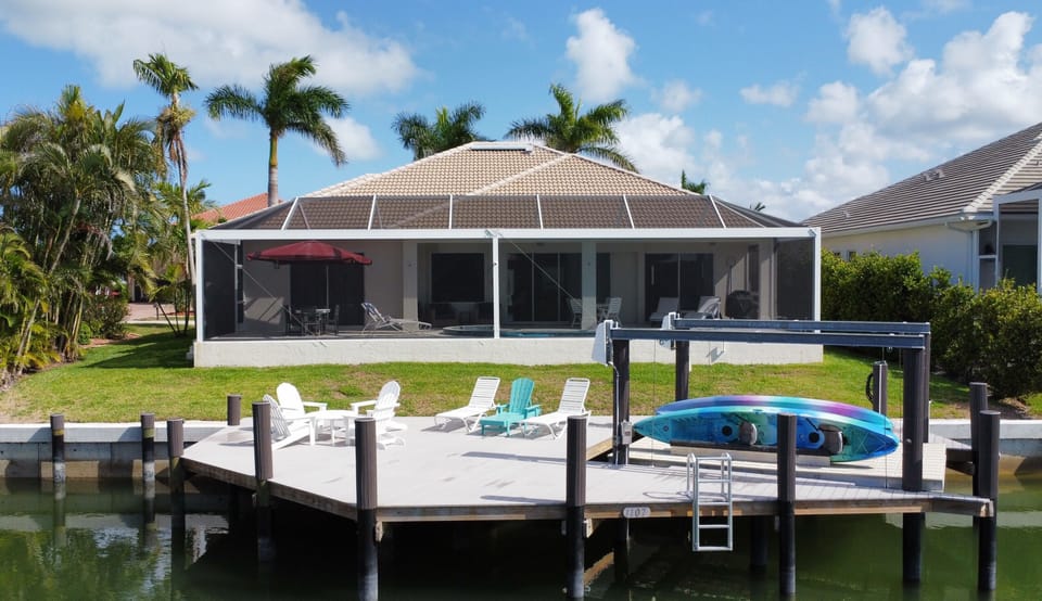 Arial view of the back of the house... dock & pool as well as kayak launch
