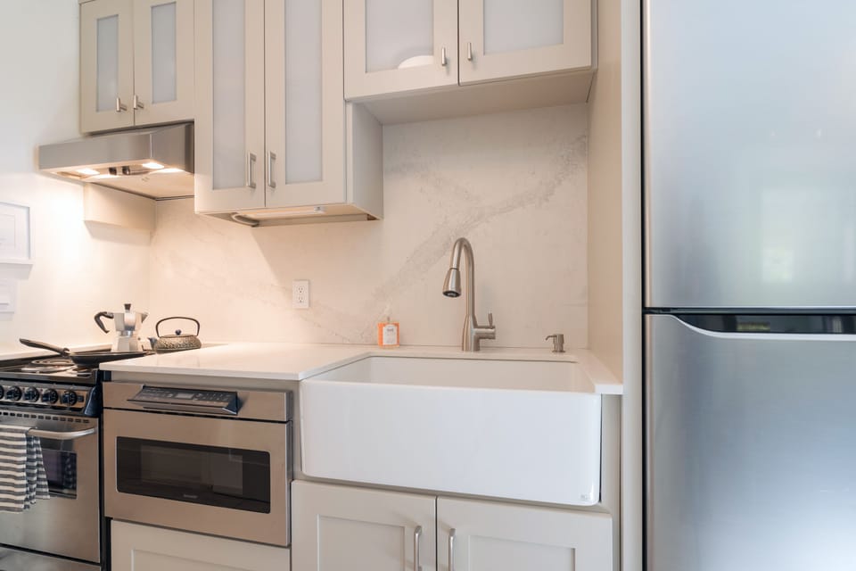 There's a full stove, range and microwave with luxury, modern finishes.