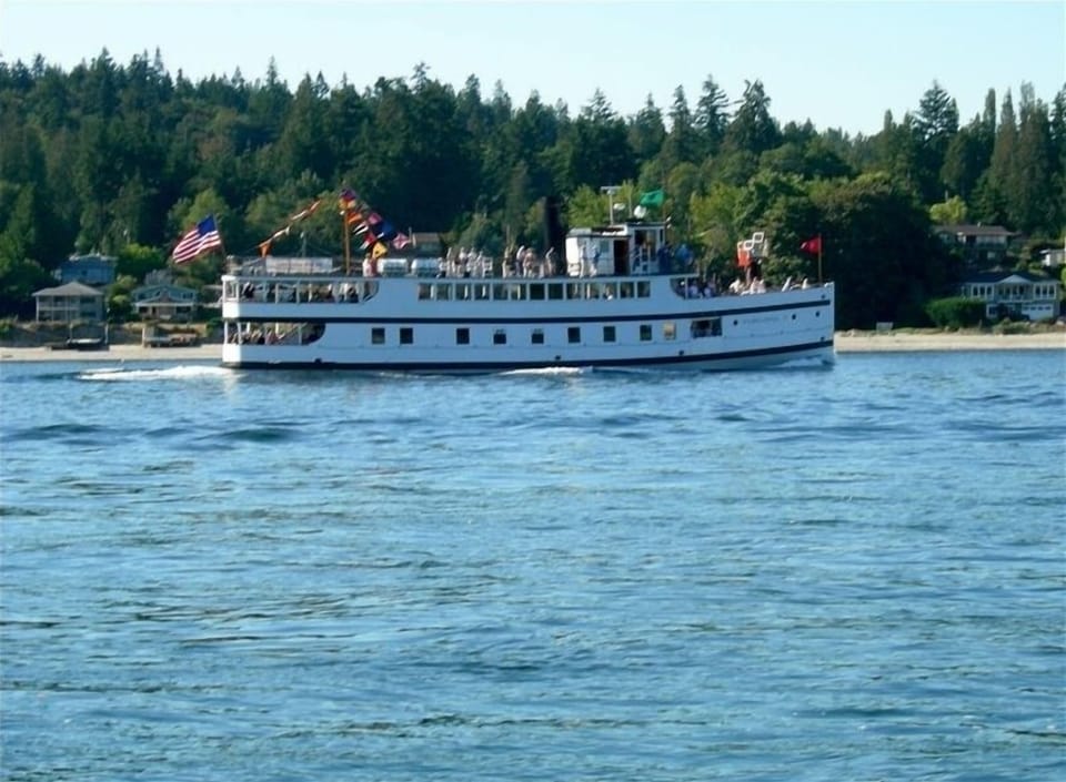 the steamship Virginia V passes by the property and house through Agate Passage