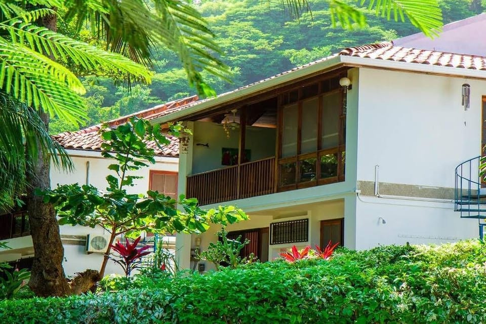 The beach side of the house with balcony above.