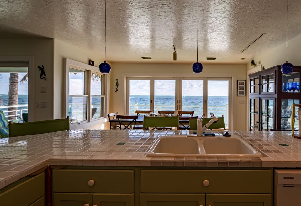 View from Kitchen, to Dining and Beyond to the water