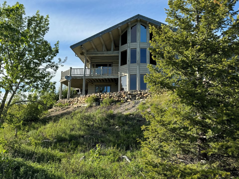 Beautiful 3 stories of windows overlooking the meadow  and creek !