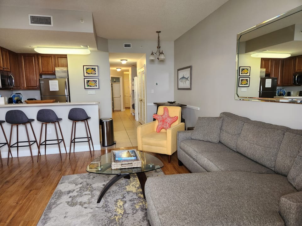 Living room with kitchen counter seating for 4