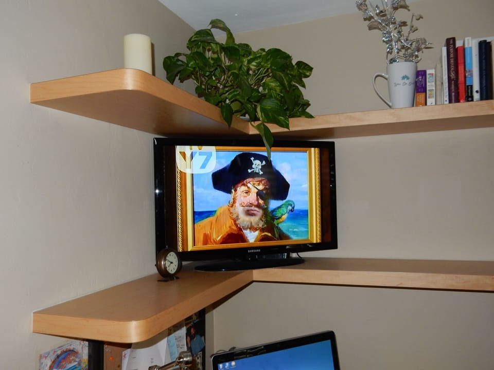 Bedroom shelving with flat screen cable TV and, work space with WIFI connection.
