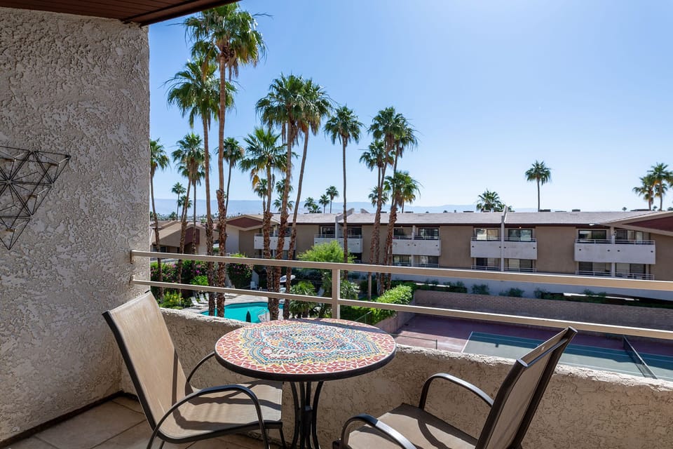 Rear balcony off bedroom pool and tennis court views