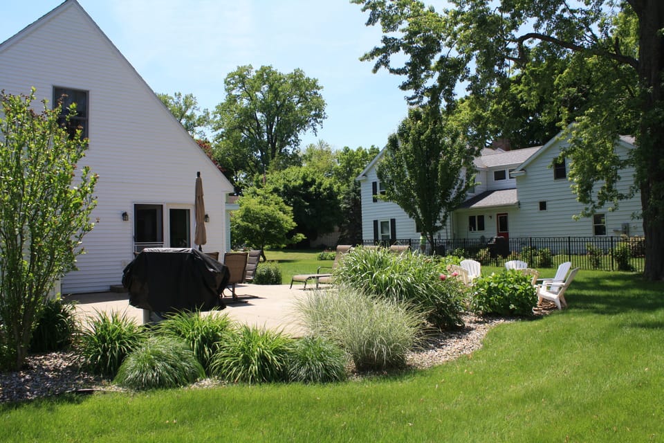Large back/side yard, small swing set/slide.