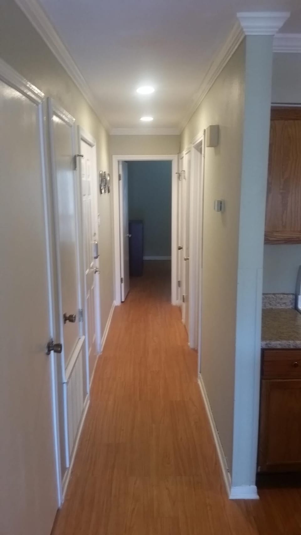 a look down the hallway into the bedroom